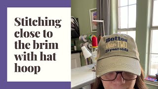 Stitching close to the brim of a hat with a brother hat hoop [upl. by Estell]