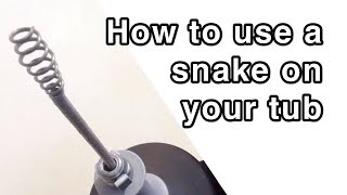 How to Unplug a Bathtub Drain Using a Snake or Drum Auger [upl. by Sharron636]