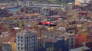 The Santander sponsored Ferrari F1 car being flown into Barcelona by helicopter [upl. by Etiuqal306]