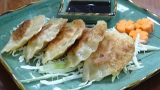 How to Make Potstickers  Easy Recipe 如何料理鍋貼） [upl. by Ahcatan]