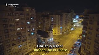 Romanians Celebrate From Their Windows During Orthodox Easter Vigil [upl. by Doralynne312]