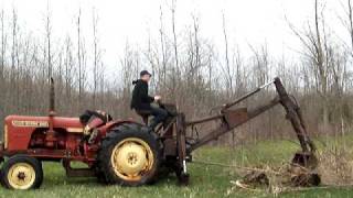 1964 David Brown backhoe clearing brush [upl. by Milburt]