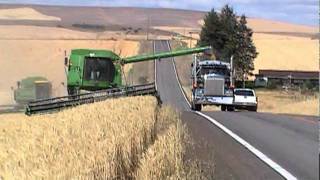 John Deere Combine Unloading On Go  Highway [upl. by Arhat]