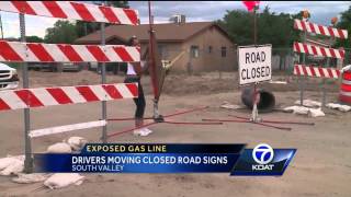 Exposed Gasline Drivers Moving Road Closed Signs [upl. by Latnahc]