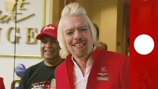 Virgin Group founder Richard Branson works as stewardess for a day [upl. by Barbarese]