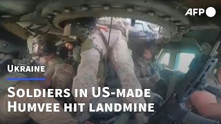 Ukrainian soldiers hit mine while inside USmade Humvee near Donetsk  AFP [upl. by Merrie607]